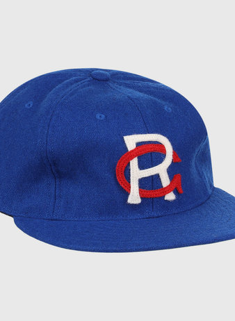 The EFF Royal Ponciana Giants 1912 Vintage Ballcap is a royal blue wool cap with a white R overlapping a red C embroidered on the front, inspired by the original 1912 team design.