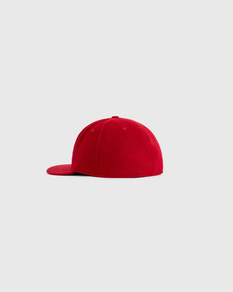 The EFF Reddy Kilowatt 1940 Authentic Wool Ballcap, shown from the side and slightly behind on a light gray background, features a vintage mascot logo inspired by classic electric power branding.