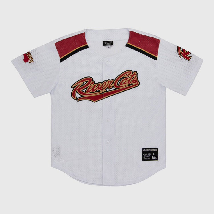 The Ebbets Field Sacramento River Cats MiLB Button Down Jersey is white with red and black accents, features the team logo across the chest, a left sleeve patch, black collar tag, and an official patch near the bottom hem.