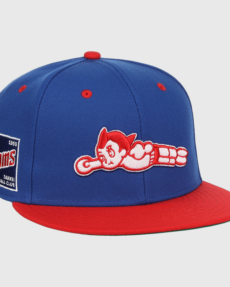The EFF Sankei Atoms DNA Fitted Ballcap is a blue and red vintage cap with an embroidered Atom Boy flying on the front and a side patch that reads Atoms Baseball Club with the number 4500.