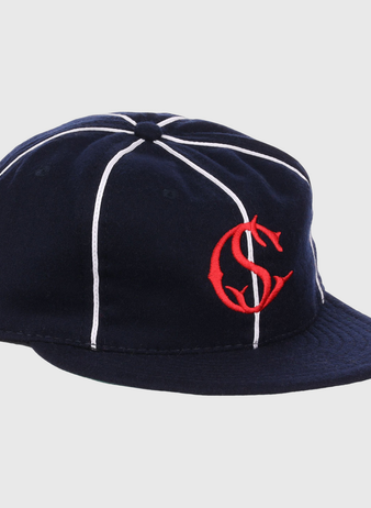 The EFF Santa Cruz Crabs 1908 Vintage Ballcap features navy blue wool with white stripes and a red interlocking “C” and “S” logo on the front, offering a timeless, classic baseball style.