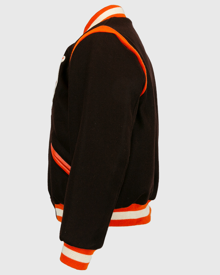 Side view of the EFF St. Louis Browns 1952 Authentic Jacket in black wool, featuring orange and white striped cuffs, collar, waistband, and orange trim along seams and pockets.