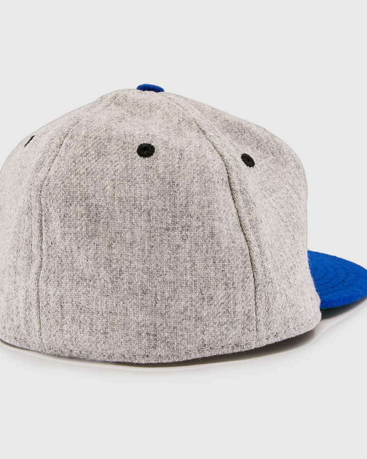The EFF St. Louis Stars 1929 Vintage Ballcap features a gray back view with black eyelets and a blue brim, inspired by the classic Negro National League design.