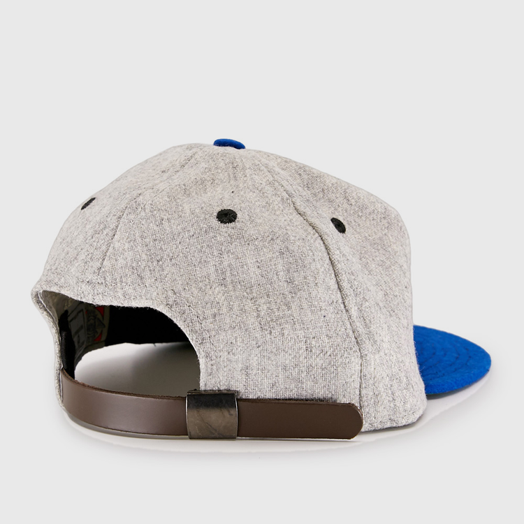 The EFF St. Louis Stars 1929 Vintage Ballcap features a gray crown, blue brim, black eyelets, and a brown adjustable strap with a black buckle, shown from the back and inspired by classic Negro National League style.