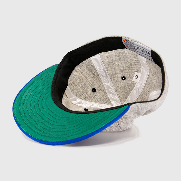 The EFF St. Louis Stars 1929 Vintage Ballcap, inspired by the Negro National League era, features a green and blue brim, black inner band, white stitched lining, and a size tag marked 7 1/4.