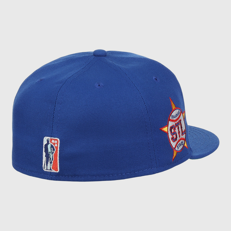 The EFF St. Louis Stars NLB Team Color Fitted Ballcap features a royal blue design with a red, white, and orange side logo and a small player logo on the back, honoring the Negro National League in vintage style.