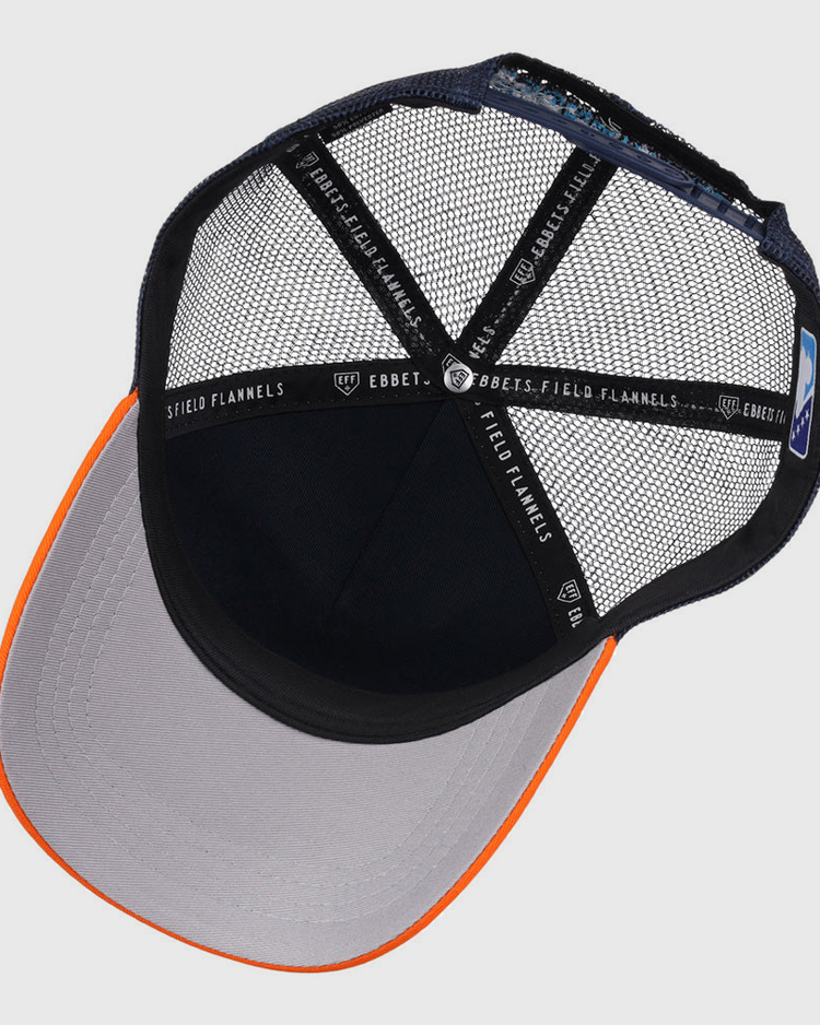 A top-down view of the Ebbets Field Sugarland Space Cowboys MiLB Trucker Ballcap shows a gray brim, orange edge, black mesh back, and interior black bands labeled 