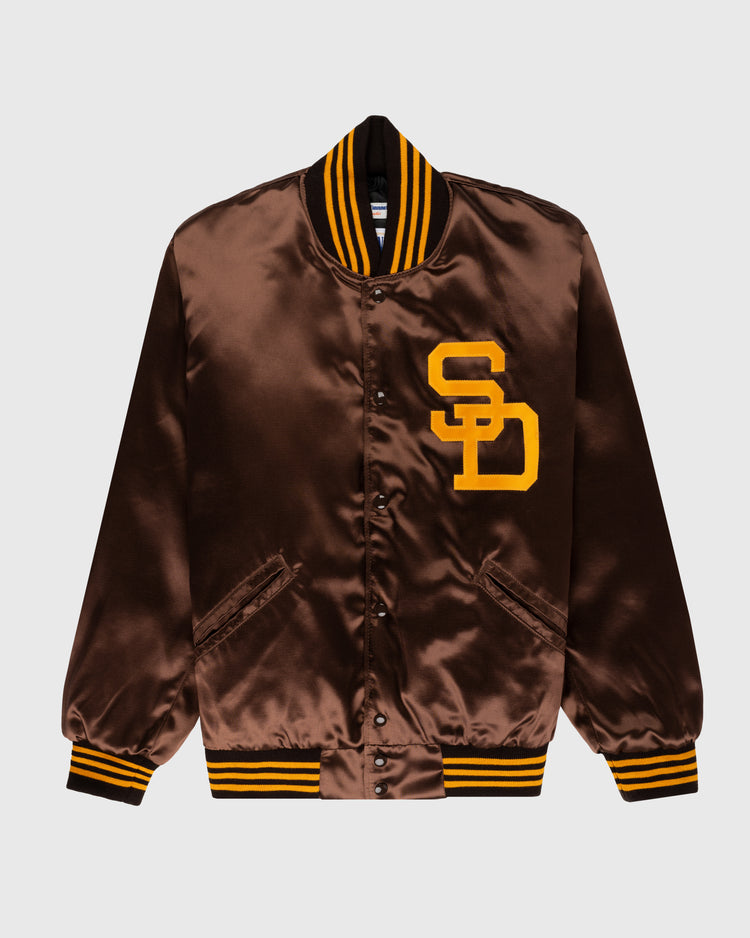 The EFF San Diego Padres 1969 Authentic All Satin Varsity Jacket features brown satin, yellow SD chest letters, and yellow-black striped cuffs, collar, and hem, replicating the team’s classic vintage style.