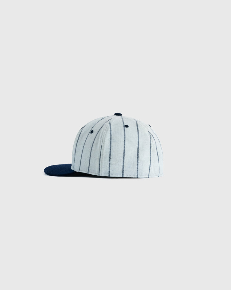 The EFF San Francisco Seals 1946 Authentic Wool Ballcap features a light gray crown with thin black stripes and a dark navy brim, shown from the side on a plain gray background—an exact 1946 SF logo reproduction.