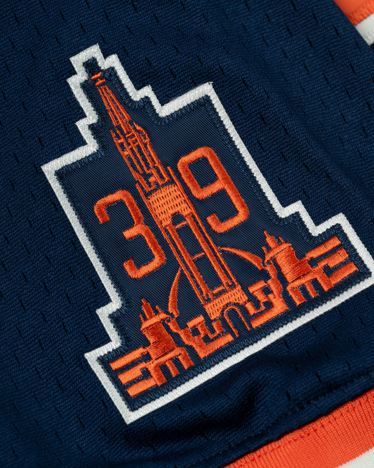 The EFF San Francisco Seals Mesh V-Neck Jersey features a navy patch with an orange skyline outline and bold orange 3 1 9 numbers, accented by white trim for a vintage baseball look.