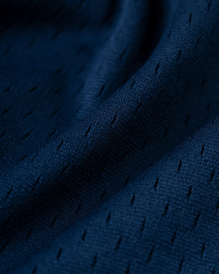 Close-up of the EFF San Francisco Seals Mesh V-Neck Jersey, featuring navy blue polyester mesh with small, evenly spaced holes and a soft, wavy texture inspired by vintage baseball jerseys.