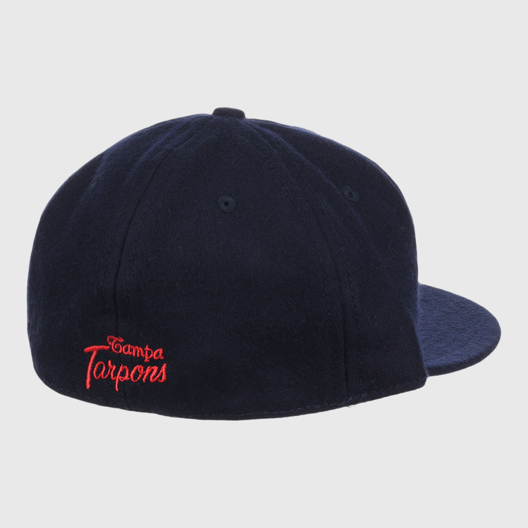 The EFF Tampa Tarpons Letterhead Wool Vintage Ballcap, in navy, features “Tampa Tarpons” embroidered in red script on the back left. The Minor League cap is shown from the back right against a white background.