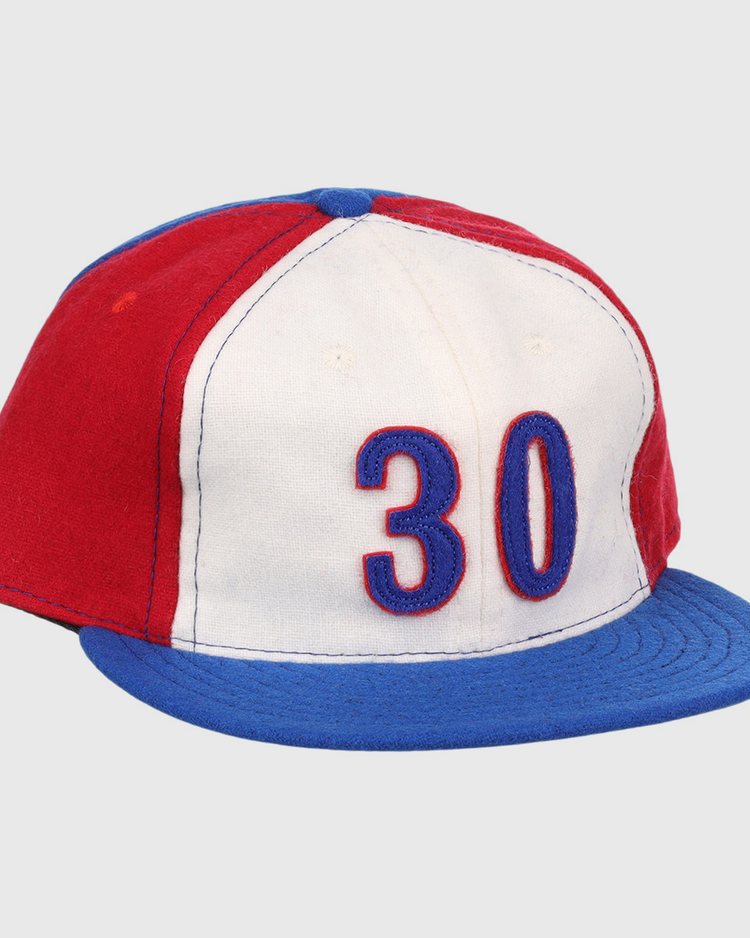 The Tim Raines Signature Series Ballcap by Ebbets Field Flannels is a vintage wool cap in red, white, and blue with 30 on the front and a blue brim—classic style perfect for National Baseball Hall of Fame fans.