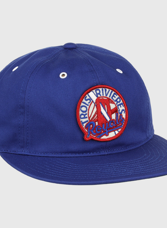 The EFF Trois Rivières Royals Cotton Twill Ballcap is royal blue cotton with a round embroidered patch that reads Trois-Rivières Royals in red and white, featuring a stylized red R at the center.