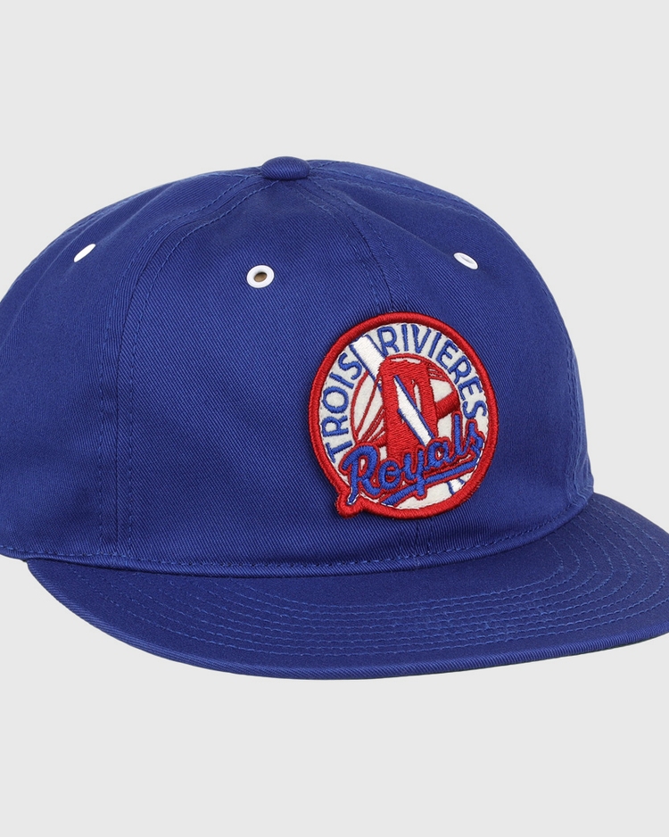 The EFF Trois Rivières Royals Cotton Twill Ballcap is royal blue cotton with a round embroidered patch that reads Trois-Rivières Royals in red and white, featuring a stylized red R at the center.