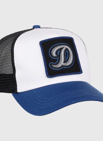 The Ebbets Field Tulsa Drillers MiLB Trucker Ballcap features a white front panel, blue bill, black mesh back, and a black patch with a large embroidered letter D on the front.