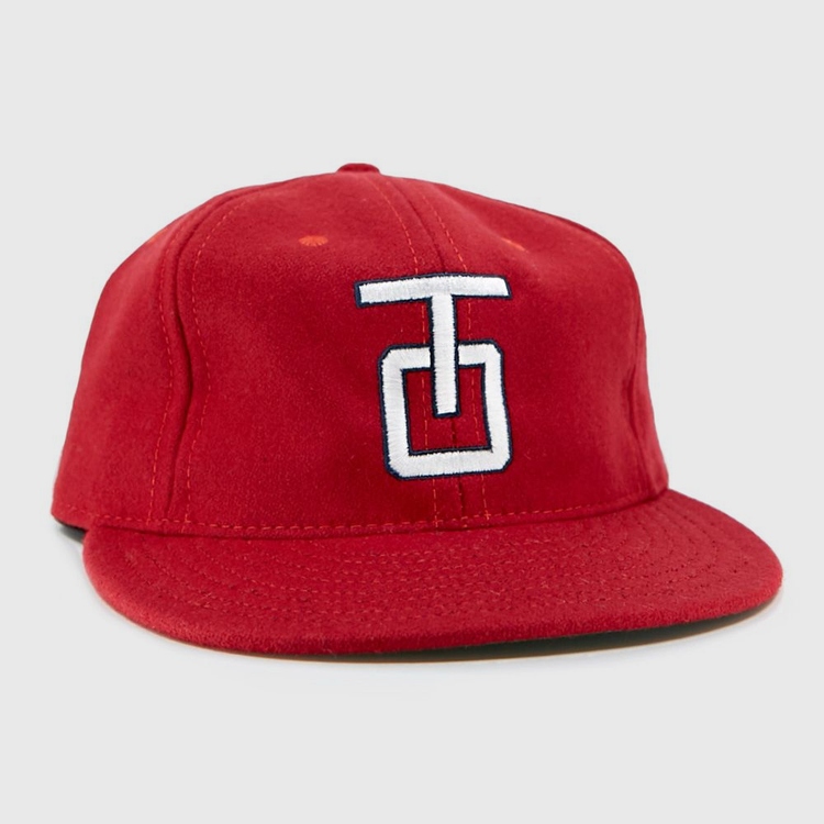 The EFF Tulsa Oilers 1966 Vintage Ballcap is a red wool cap with a flat brim and a white and blue embroidered TG logo on the front.