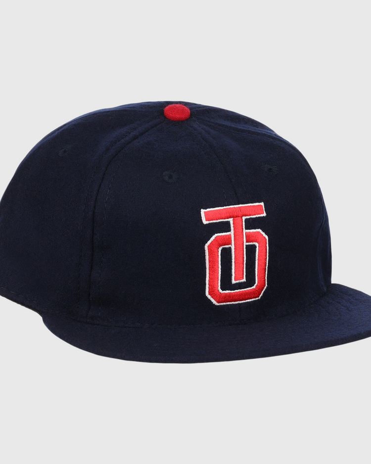 The EFF Tulsa Oilers 1969 Vintage Ballcap is a navy cap with a red and white embroidered TJ logo, red top button, and classic styling inspired by the 1969 Pacific Coast League design.