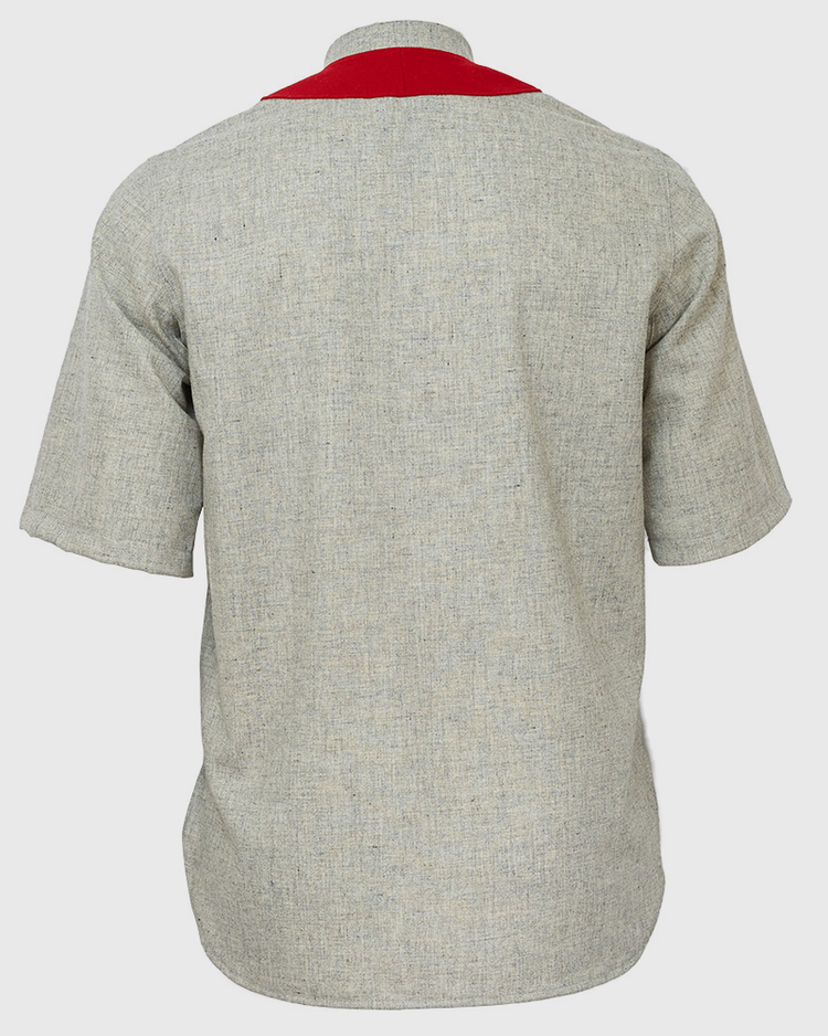 The EFF University of Arkansas 1912 Road Jersey is a light grey short-sleeved shirt with a red accent across the upper back, authentically reproducing a classic Razorbacks look.
