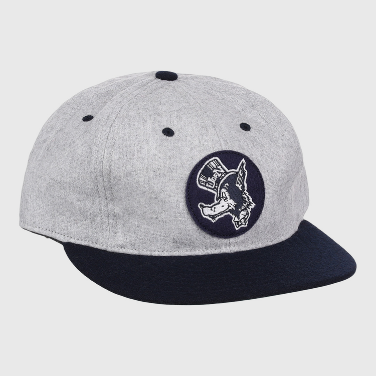 The EFF University of Nevada Wolf Pack Mascot Collegiate Wool Ballcap features a vintage gray crown, dark blue brim, and a front circular patch of a donkey in a hat—an officially licensed college vault design.