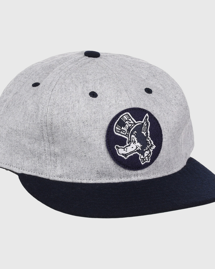 The EFF University of Nevada Wolf Pack Mascot Collegiate Wool Ballcap features a vintage gray crown, dark blue brim, and a front circular patch of a donkey in a hat—an officially licensed college vault design.