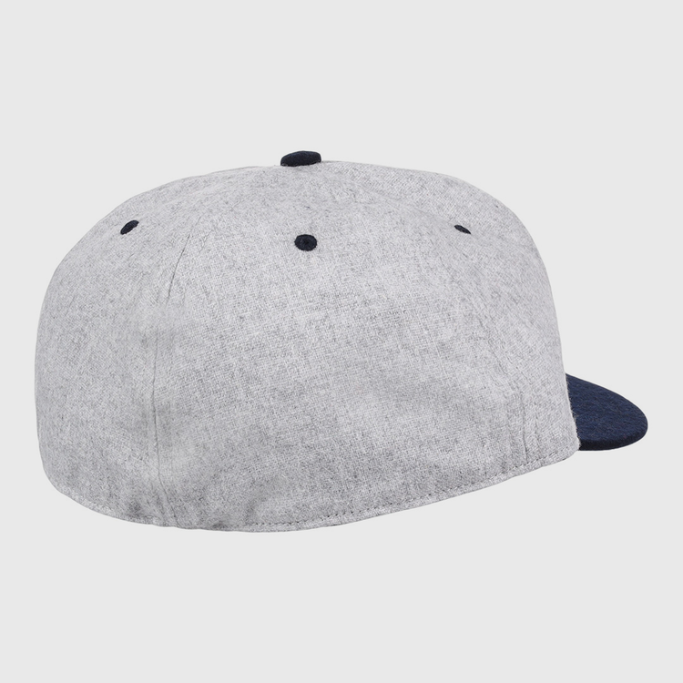 An officially licensed EFF University of Nevada Wolf Pack Mascot Collegiate Wool Ballcap with a gray crown, dark blue brim and button, back and side view, features ventilation eyelets on top—perfect for vintage fans.