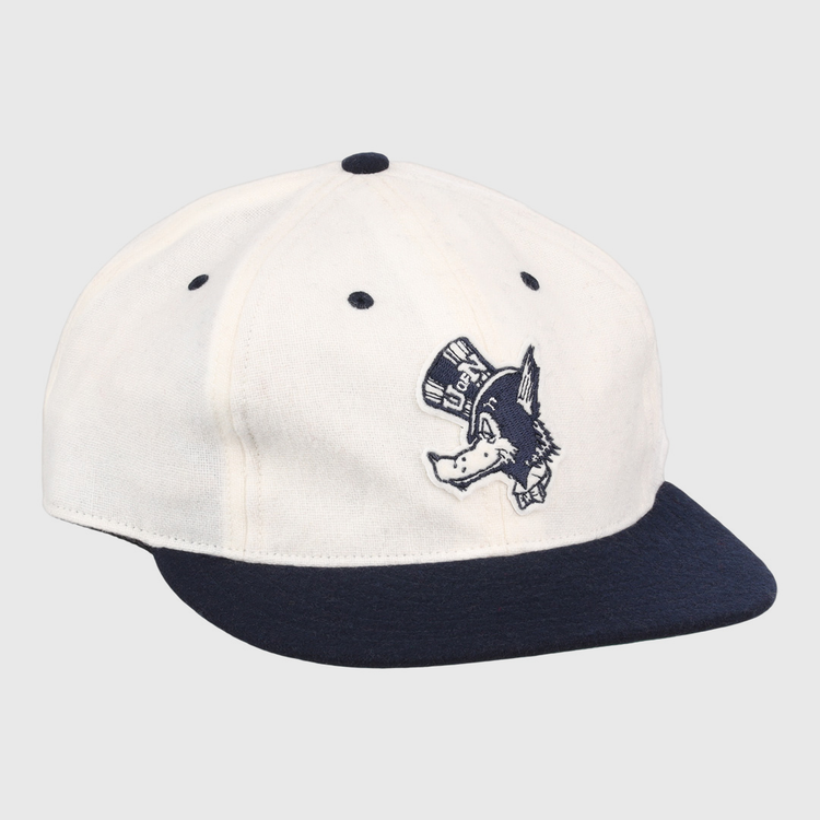 The EFF University of Nevada Wolf Pack Mascot Collegiate Wool Ballcap in white features a navy brim and button, plus an embroidered Wolf Pack logo—perfect for standout collegiate style.