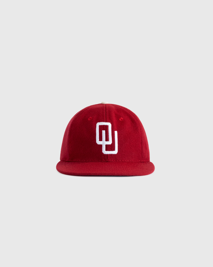 The EFF University of Oklahoma 1975 Authentic Wool Ballcap features a red design with a white interlocking OU logo, inspired by the classic Sooners cap and shown against a plain light gray background.