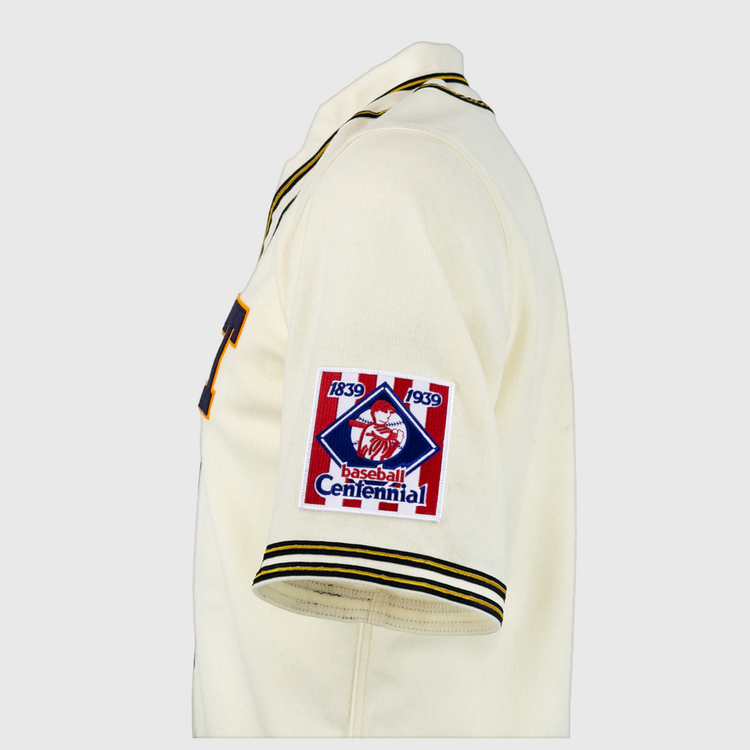 The EFF University of Pittsburgh 1939 Jersey is a cream authentic reproduction with black and yellow trim and a Baseball Centennial 1839-1939 patch on the left sleeve—ideal for collegiate baseball fans and collectors.