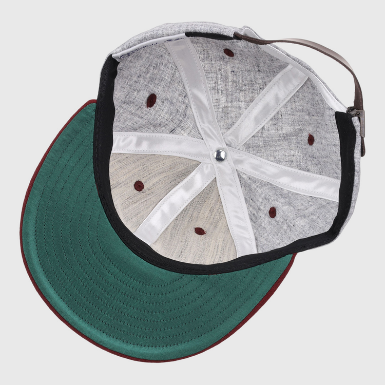 Interior view of the EFF University of South Carolina 1949 Vintage Ballcap shows a green underbrim, maroon edge, visible interior panels and seams, plus a brown adjustable strap.