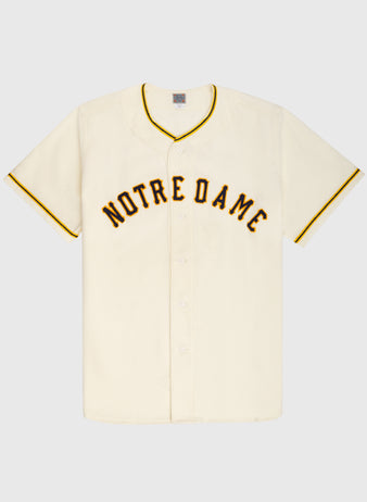 The Ebbets Field University of Notre Dame 1956 Authentic Wool Home Baseball Jersey features vintage short sleeves, cream color, bold black and yellow NOTRE DAME lettering, and yellow trim—a true Fighting Irish classic.