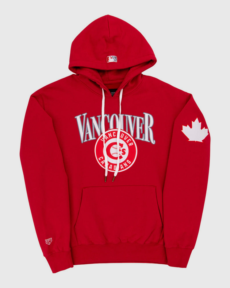 The Ebbets Field Vancouver Canadians MiLB Cotton Hooded Sweatshirt features red fabric, “Vancouver” and “Canadians” on the chest, a maple leaf on the left sleeve, white drawstrings, and a front pocket.