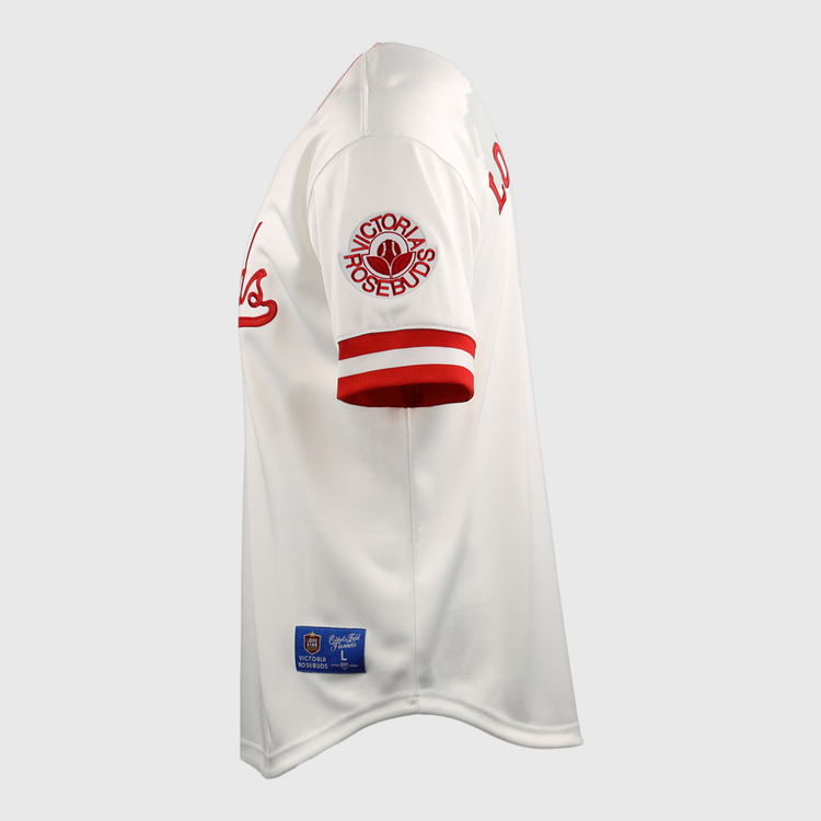 The Victoria Rosebuds EFF Lone Star Baseball Jersey by EFF features red sleeve stripes, a PORTLAND ROSEBUDS patch, red script on the chest, and a blue and gold tag near the hem inspired by North Division rivals.