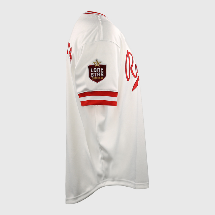The EFF Victoria Rosebuds Lone Star Baseball Jersey is white with red trim, a Lone Star patch on the left sleeve, and red Re lettering on the chest. This side-view jersey represents the Victoria Rosebuds of the Lone Star League North Division.