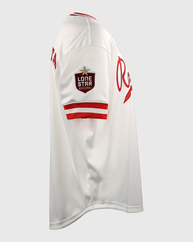 The EFF Victoria Rosebuds Lone Star Baseball Jersey is white with red trim, a Lone Star patch on the left sleeve, and red Re lettering on the chest. This side-view jersey represents the Victoria Rosebuds of the Lone Star League North Division.