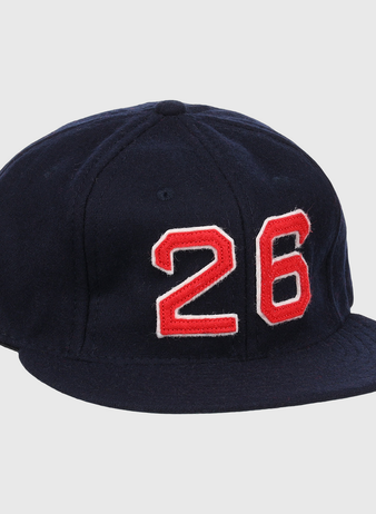 The Ebbets Field Flannels Wade Boggs Signature Series Ballcap is a dark blue vintage wool cap with a red and white number 26 on the front, inspired by classic styles from the National Baseball Hall of Fame.
