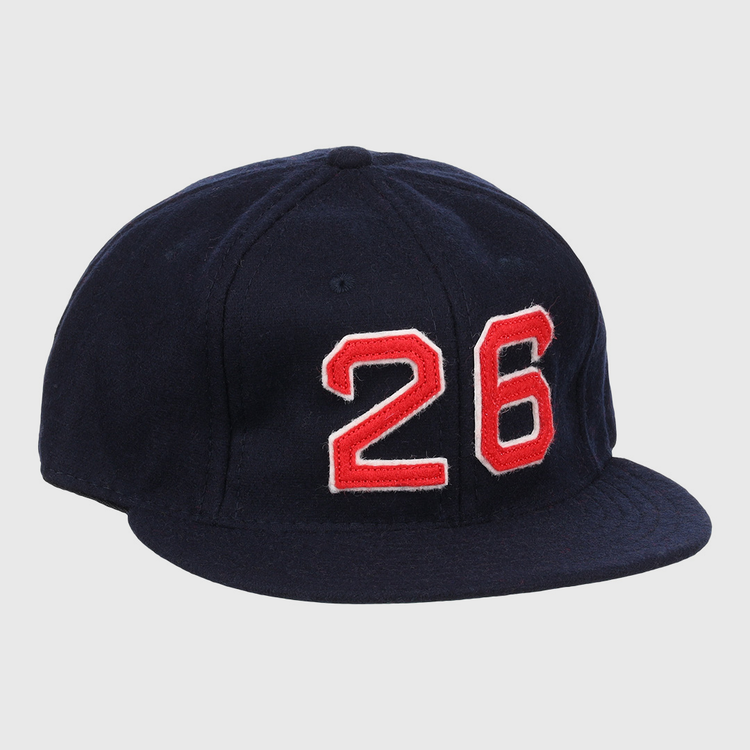 The Ebbets Field Flannels Wade Boggs Signature Series Ballcap is a dark blue vintage wool cap with a red and white number 26 on the front, inspired by classic styles from the National Baseball Hall of Fame.