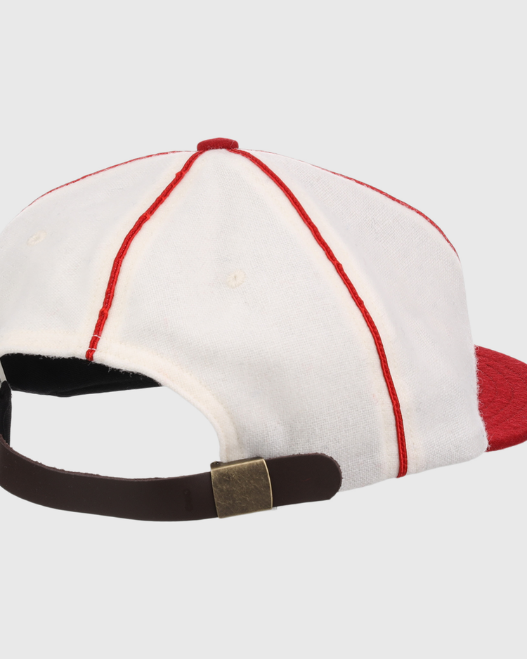 The EFF Washington Elite Giants 1936 Vintage Ballcap is shown from the back with white fabric, red seams, a red brim, and an adjustable brown strap with a brass-colored buckle.