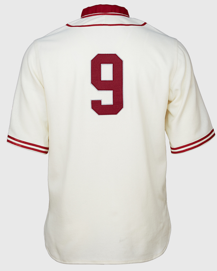 The EFF Washington State University 1937 Home Jersey is a white baseball jersey with red sleeve and collar trim, featuring a large red number 9 on the back—an authentic vintage reproduction for Cougars fans.