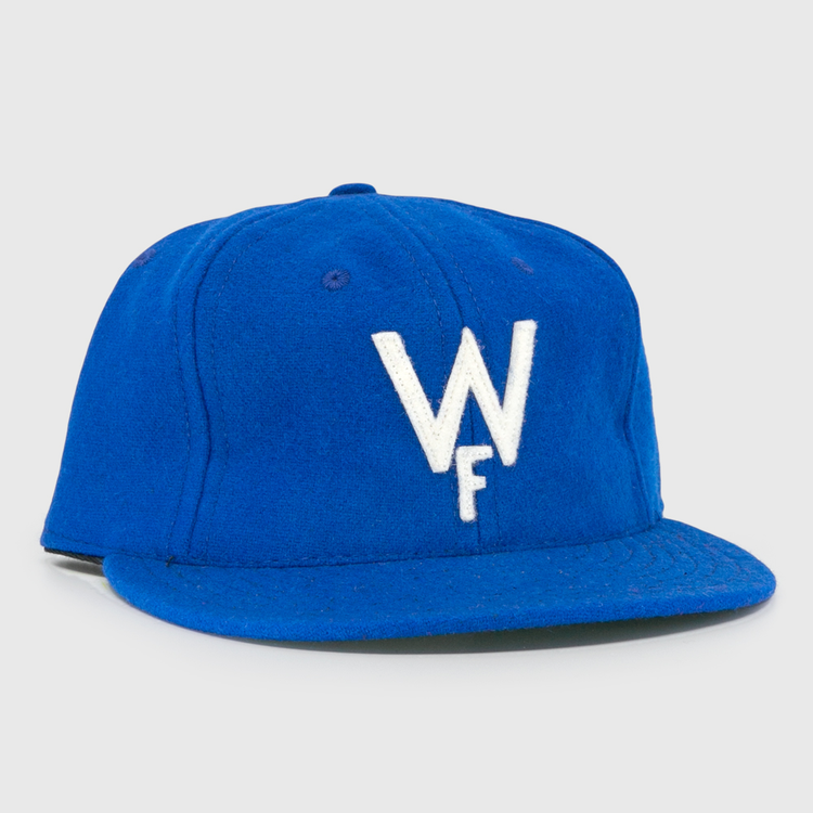 The Wichita Falls Spudders 1956 Vintage Ballcap by EFF is a royal blue wool baseball hat with a white embroidered W over F, classic structured design, and flat brim—perfect for true fans.