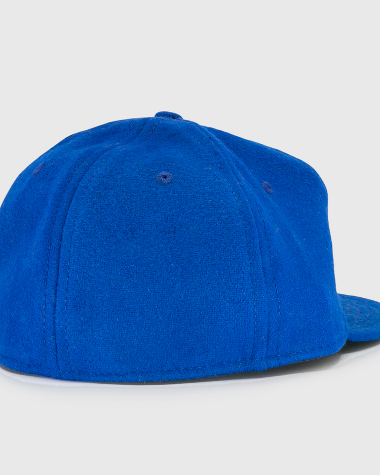 The EFF Wichita Falls Spudders 1956 Vintage Ballcap is shown from the back on a white background, featuring bright blue, soft textured fabric with a rounded crown and flat brim.