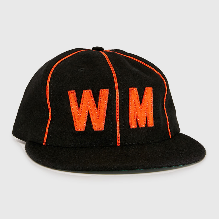 The EFF Wichita Monrovians 1925 Vintage Ballcap is a black cap with bright orange piping and a large orange embroidered WM on the front, inspired by the classic teams original design.