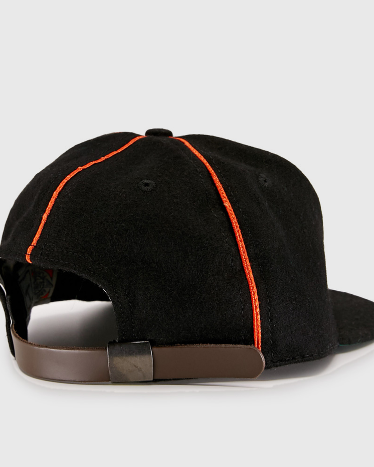 The EFF Wichita Monrovians 1925 Vintage Ballcap features red stitching and a brown adjustable strap with metal clasp, shown from the back. Inspired by classic Negro Leagues style.