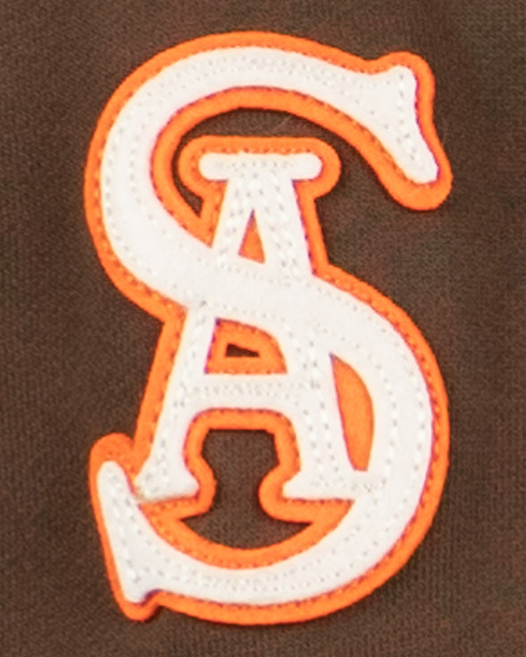 The EFF San Antonio Missions French Terry Script Hooded Sweatshirt features a white and orange embroidered S & A on dark brown fabric, inspired by classic Texas League baseball style.