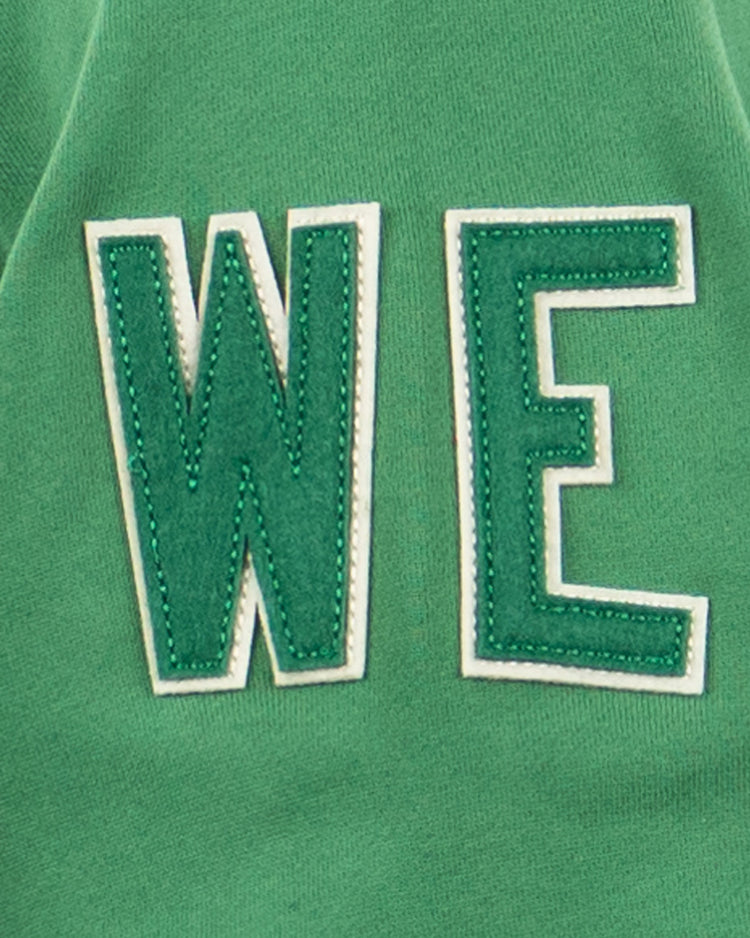 EFF’s Denver White Elephants French Terry Script Hooded Sweatshirt features green fabric and large, white-outlined WE letters, echoing the iconic baseball style of teams like the White Elephants.