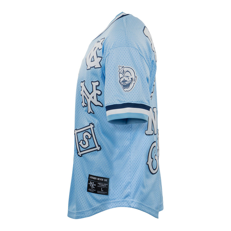 The EFF Negro League Allover Vintage Inspired NL Replica V-Neck Mesh Jersey in light blue features white and navy patches, including letters and a cartoon face, plus a black label at the bottom hem.