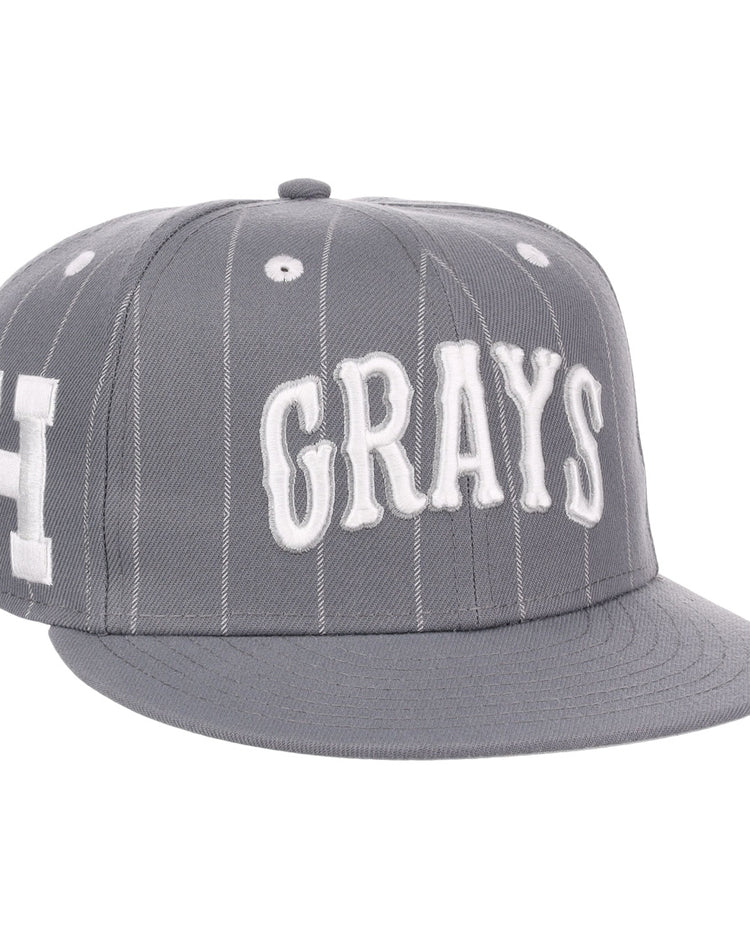 The EFF Homestead Grays NLB Black Pinstripe Fitted Ballcap features thin white stripes, bold GRAYS embroidery on the front, and a white H on the side, honoring the legendary Negro National League team.