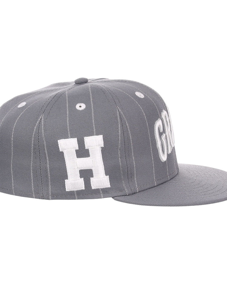 The EFF Homestead Grays NLB Black Pinstripe Fitted Ballcap features white pinstripes on gray, a bold white “H” logo, and a flat gray brim, honoring Negro National League heritage.