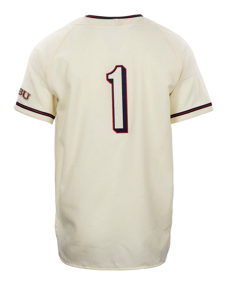 The EFF Dallas Baptist University Home Jersey is cream-colored with dark piping on the sleeves and collar, features a bold number 1 on the back, and has SBU lettering on the left sleeve.