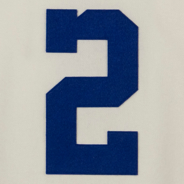 A large, bold blue number 2 is centered on a plain light background, capturing the classic style of an authentic EFF Morgan State University 1975 Home Jersey.
